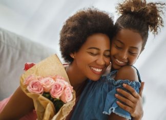 child giving a gift to mom
