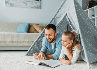 father and daughter reading at home