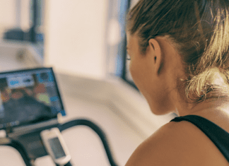 woman riding peloton bike