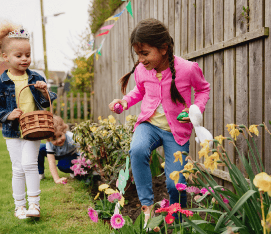 kids hunting for Easter eggs in back yard