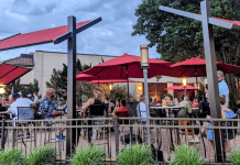 restaurant patio tables with red umbrellas