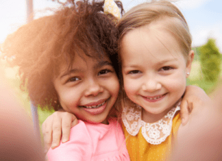 two happy girls smiling