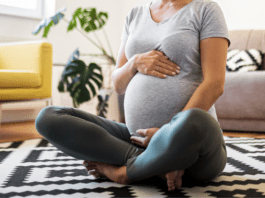 Pregnant woman sitting on the floor